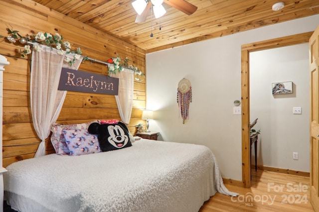 bedroom with ceiling fan, wood ceiling, and hardwood / wood-style floors