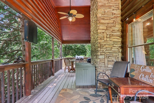 wooden deck featuring ceiling fan