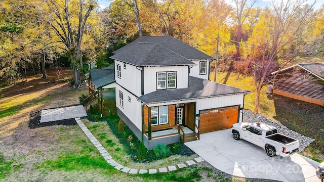 view of front of house with a front lawn and a garage