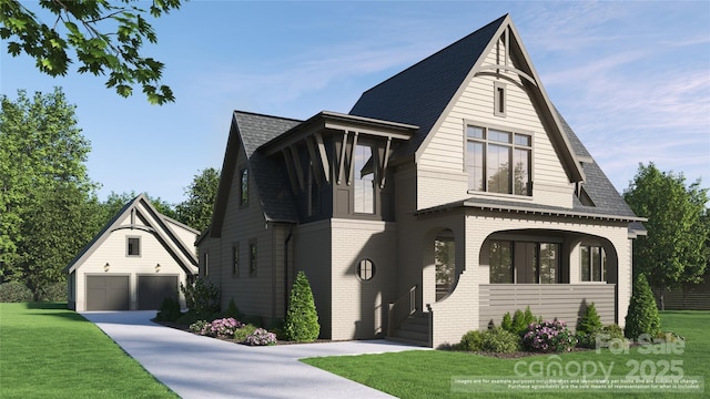 view of front of property featuring a garage, an outbuilding, and a front yard