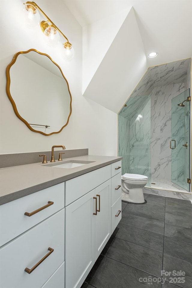 bathroom featuring recessed lighting, vanity, toilet, and a marble finish shower