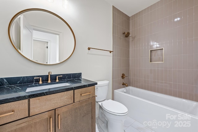 bathroom with vanity, washtub / shower combination, and toilet