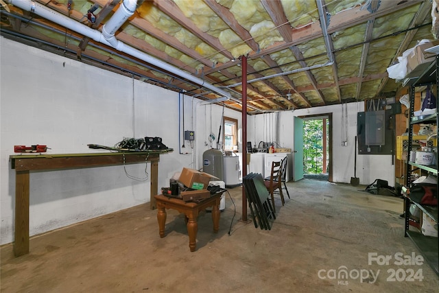 basement with separate washer and dryer and electric panel