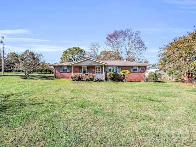 ranch-style house with a porch and a front yard