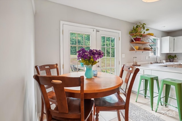 tiled dining area featuring sink