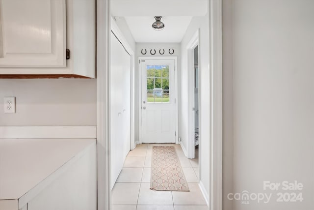 entryway featuring light tile patterned floors