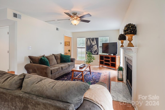 living room with ceiling fan and hardwood / wood-style flooring