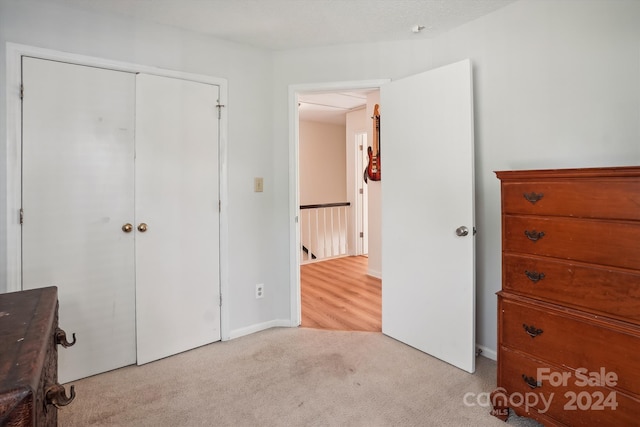 carpeted bedroom featuring a closet