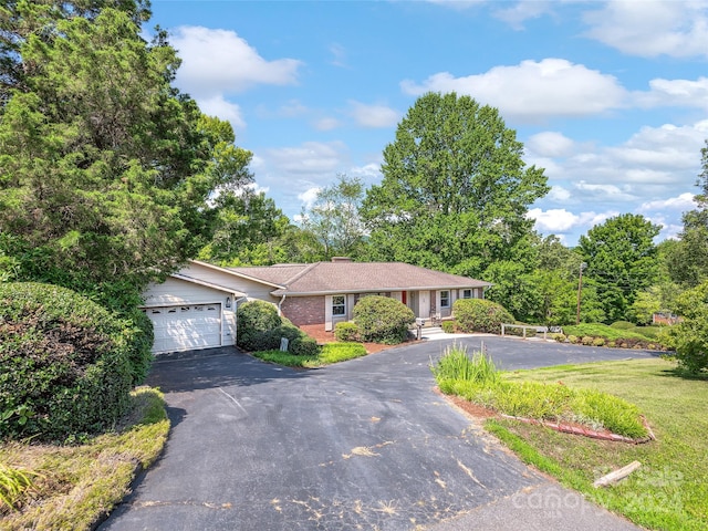 single story home featuring a garage