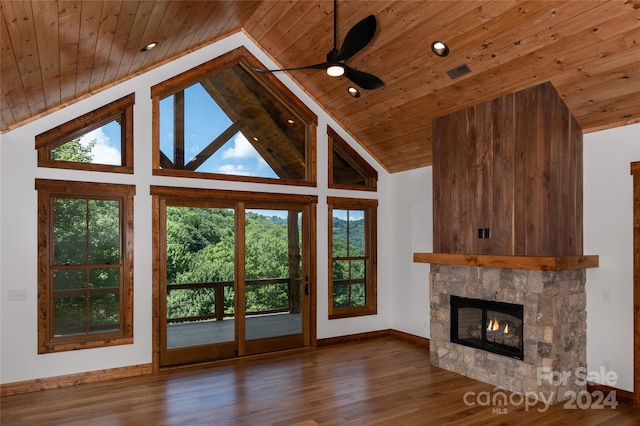 unfurnished living room featuring high vaulted ceiling, a stone fireplace, and wood ceiling