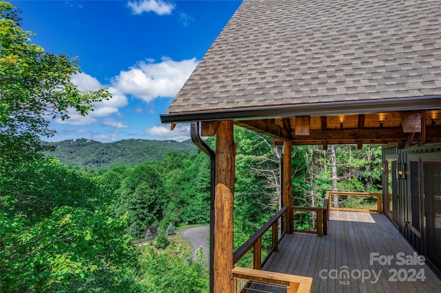 wooden deck with a mountain view