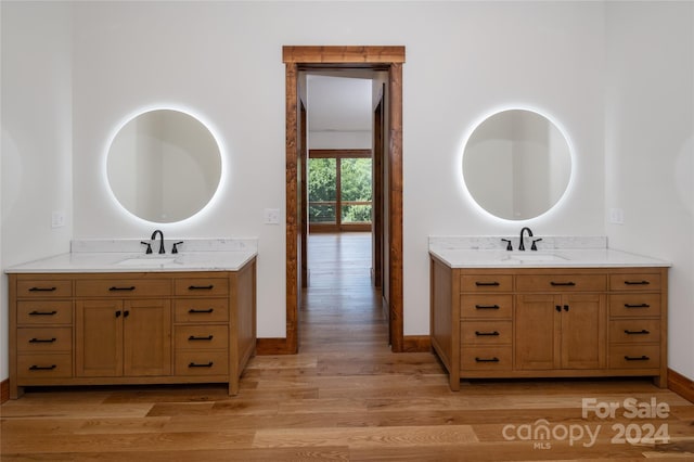 bathroom with wood-type flooring and vanity