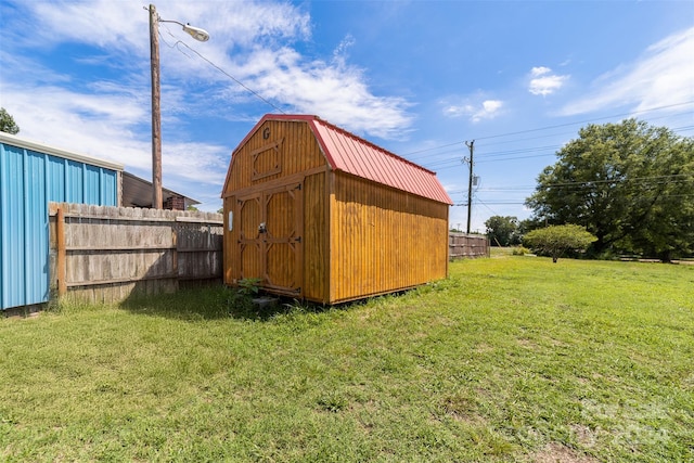 view of outdoor structure with a lawn