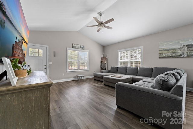 living room with dark hardwood / wood-style floors, a healthy amount of sunlight, and ceiling fan