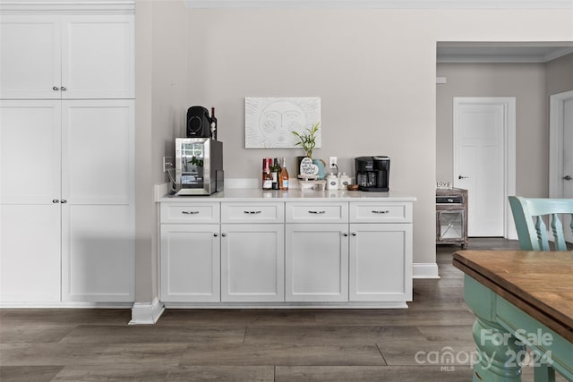 bar featuring white cabinetry and dark wood-type flooring