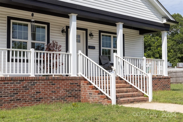 entrance to property featuring a porch