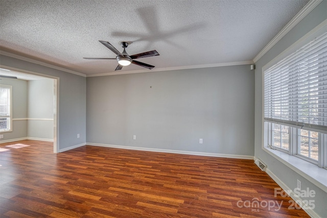 spare room with dark wood-type flooring, ceiling fan, crown molding, and a textured ceiling