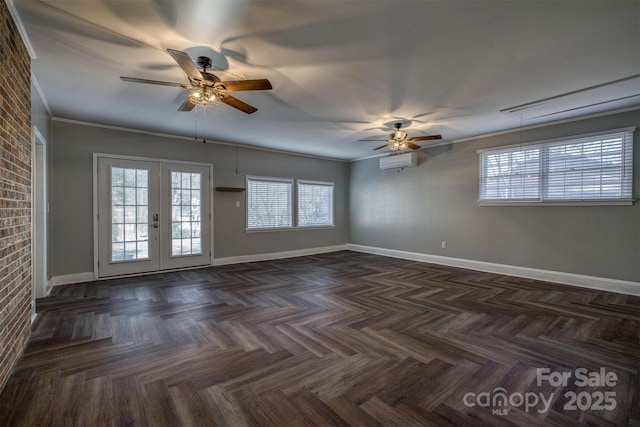 empty room featuring french doors, ornamental molding, dark parquet flooring, and a wall mounted AC