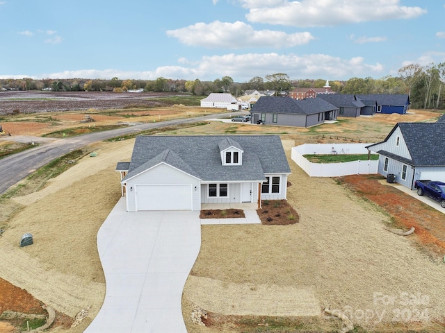 view of front of house with a garage and covered porch