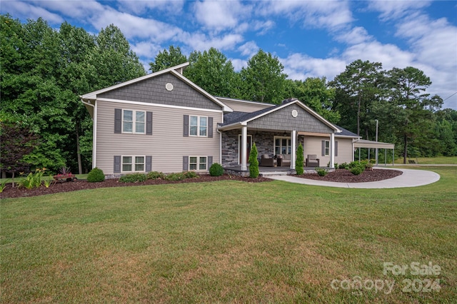 tri-level home with a front yard