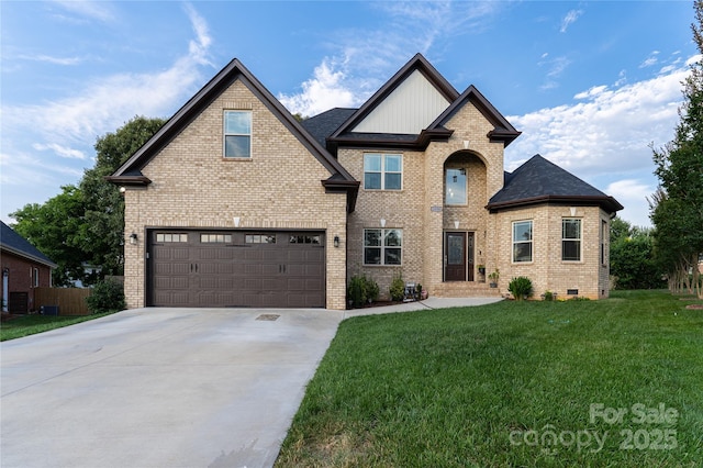 view of front of property featuring a garage and a front yard