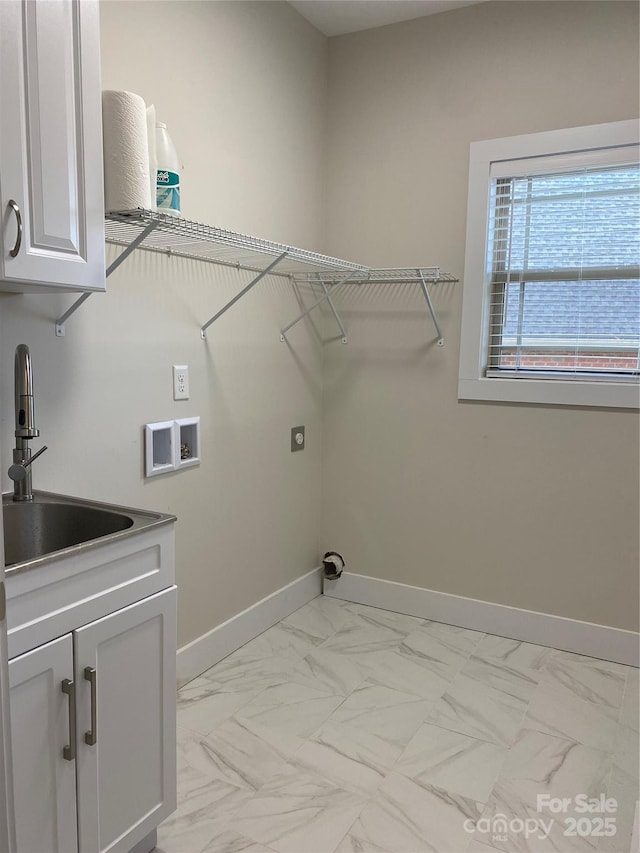 laundry area with cabinets, hookup for a washing machine, sink, and hookup for an electric dryer