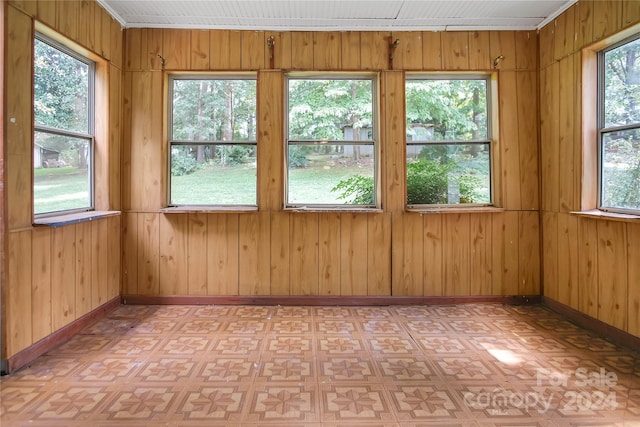 unfurnished sunroom featuring a wealth of natural light