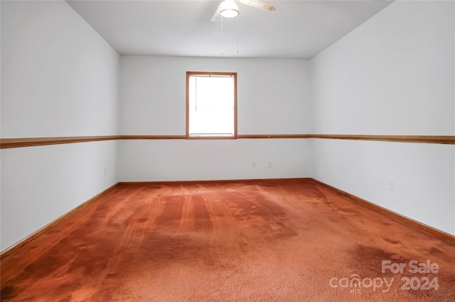 spare room with ceiling fan and carpet floors