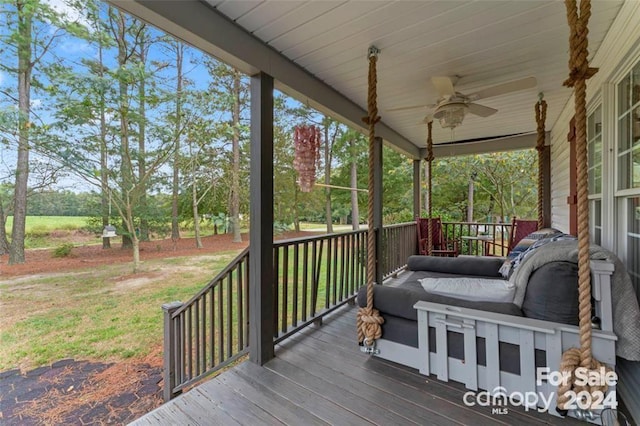 wooden terrace with ceiling fan