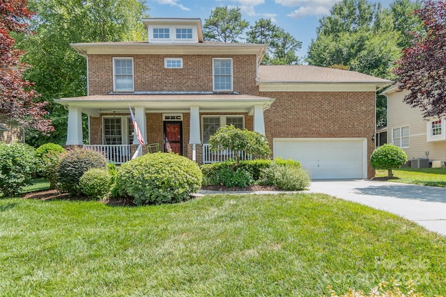 view of front of home with a porch, a front lawn, and central AC unit