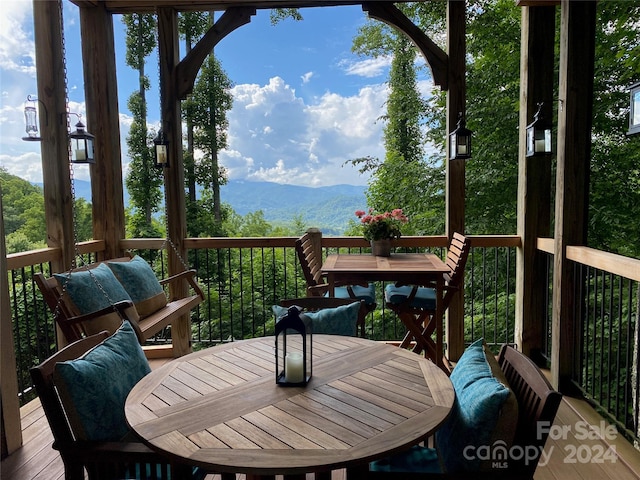 wooden terrace featuring a mountain view