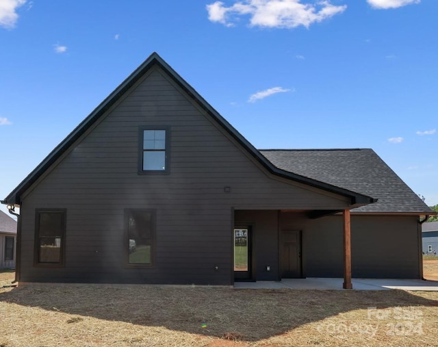 back of property with a patio area