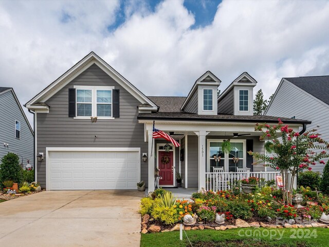 view of front of property with a porch and a garage