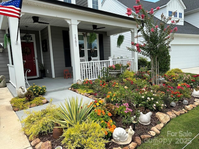 entrance to property featuring a garage and a porch