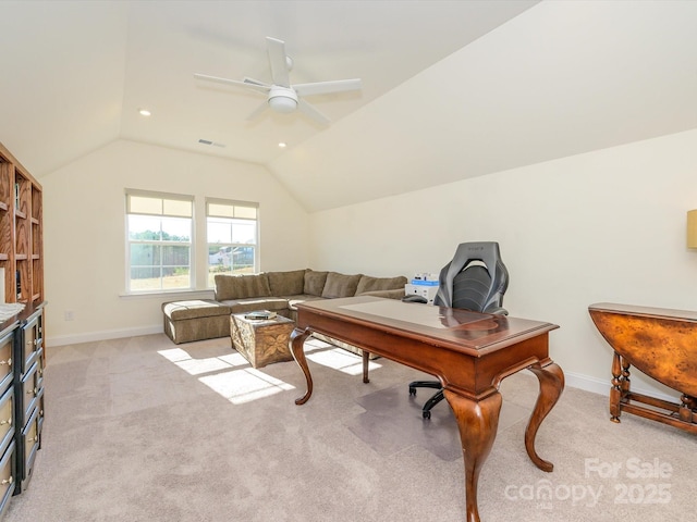 carpeted office with vaulted ceiling and ceiling fan