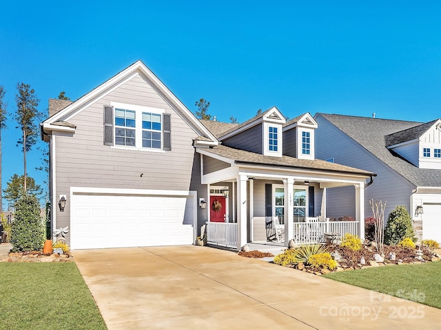 view of front facade with a garage and a porch