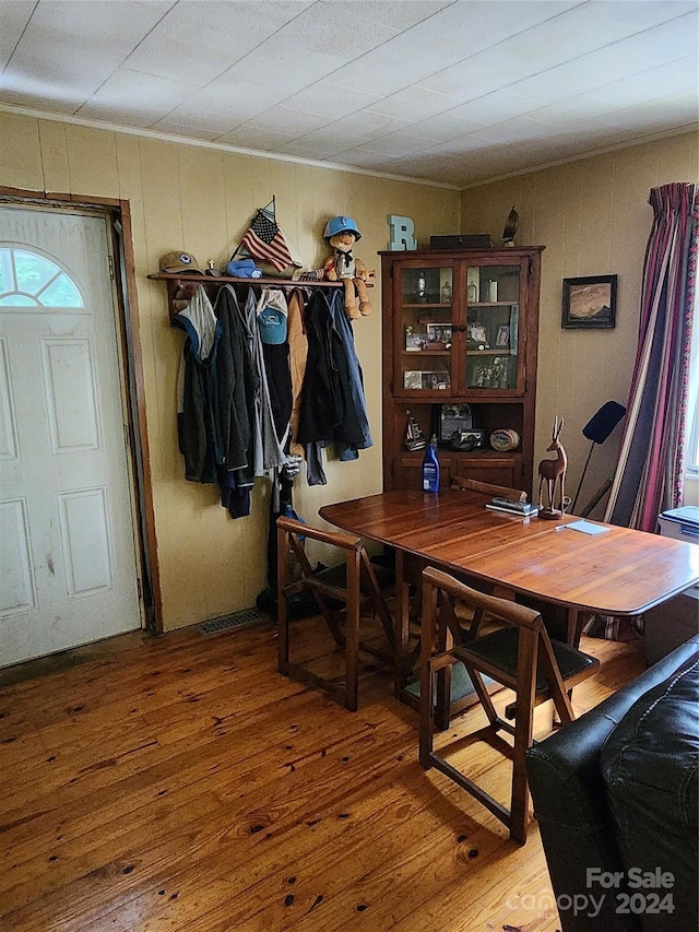 dining space with hardwood / wood-style flooring