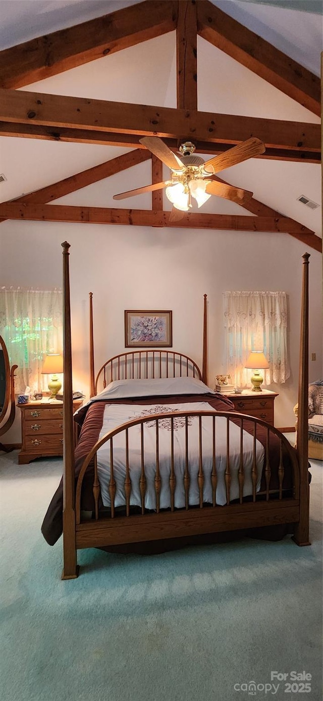 carpeted bedroom with vaulted ceiling with beams