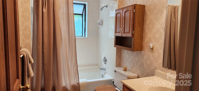 full bathroom featuring vanity, shower / bath combo, and toilet