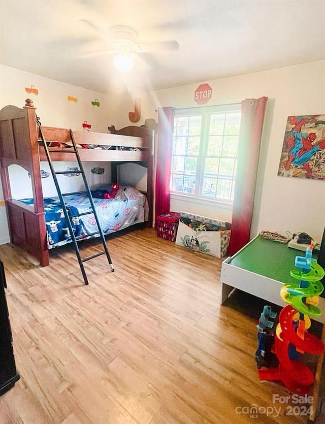 bedroom featuring ceiling fan and wood-type flooring