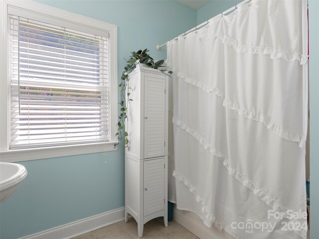 bathroom with tile patterned flooring