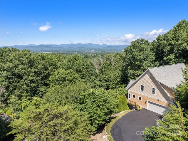 drone / aerial view featuring a mountain view