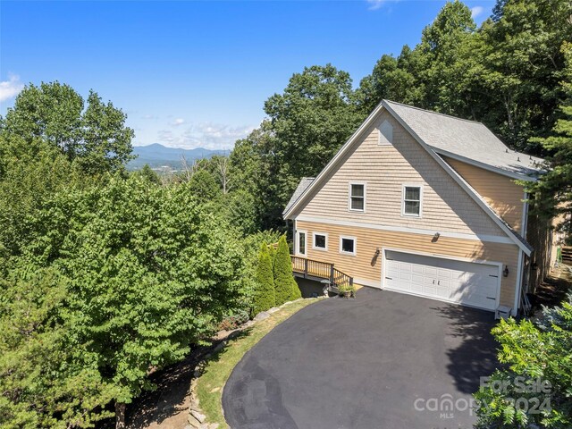 view of property exterior featuring a garage