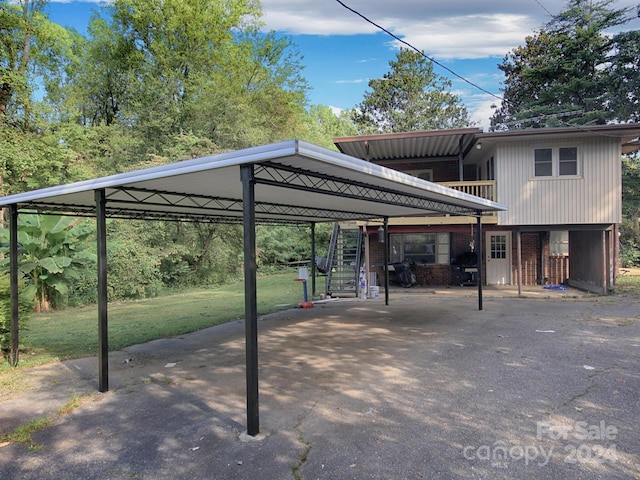 view of parking featuring a carport and a yard