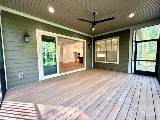 wooden terrace featuring ceiling fan