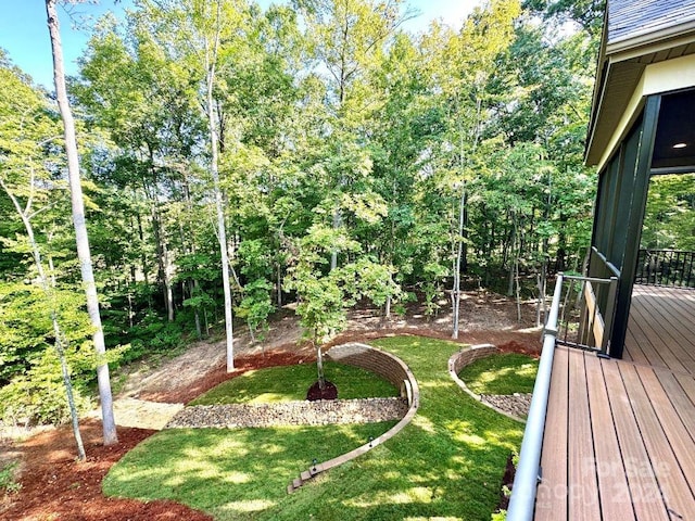 view of yard with a wooden deck