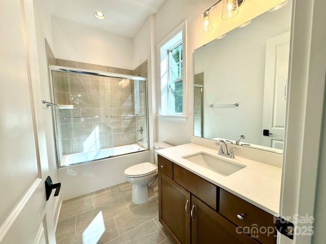 full bath with toilet, recessed lighting, combined bath / shower with glass door, and vanity