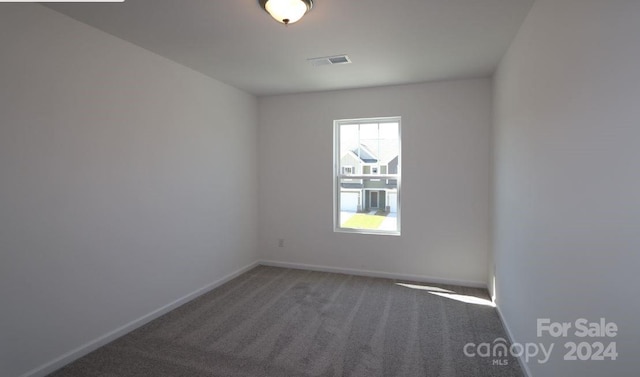 unfurnished room featuring carpet flooring