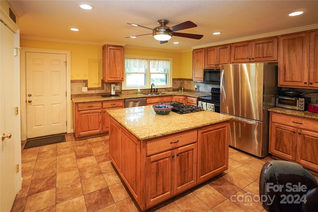 kitchen with tasteful backsplash, black appliances, light tile patterned floors, a center island, and ceiling fan