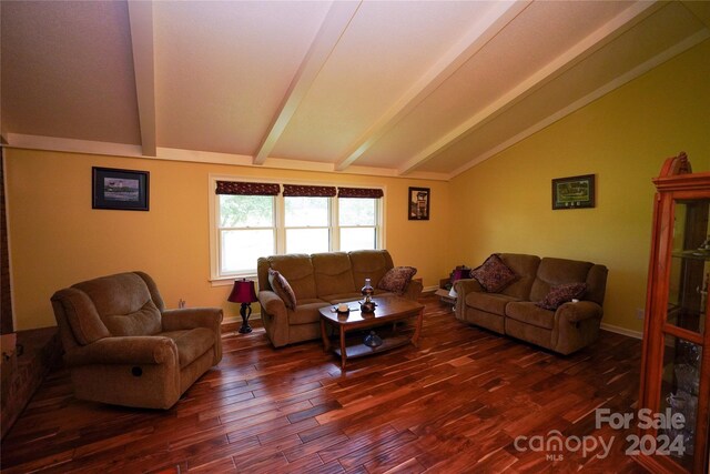 living room featuring dark hardwood / wood-style floors and vaulted ceiling with beams